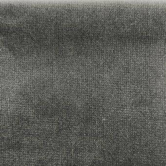 Gray velvet fabric texture with a dense, directional pile and subtle sheen; visible woven grid pattern, neutral tone.